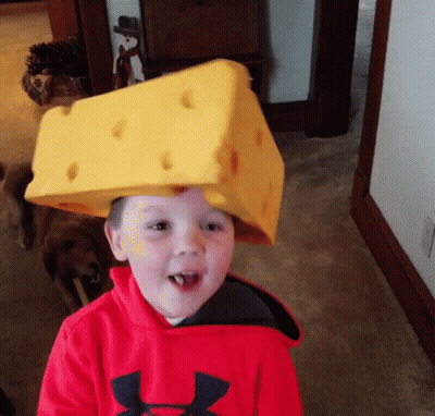 Young Boy In Red Under Armour Sweatshirt With Cheese Hat GIF