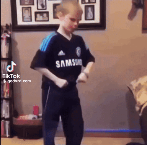 Young Boy In Samsung Shirt Dancing In Living Room GIF