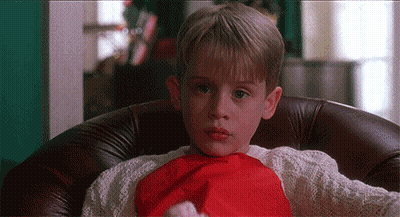 Young Boy In Santa Hat And Red Scarf GIF