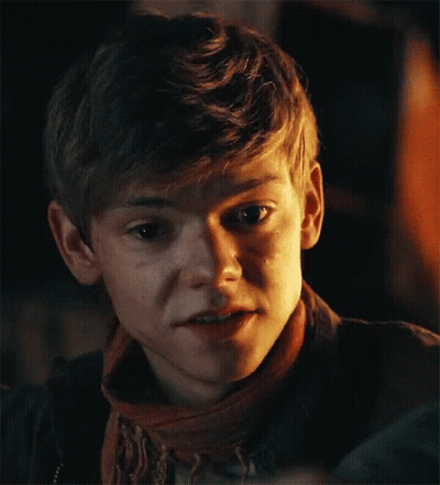 Young Boy In Scarf And Jacket Making Funny Face GIF