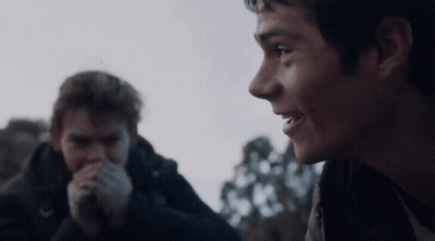 Young Boy In Scarf And Jacket Making Funny Face GIF