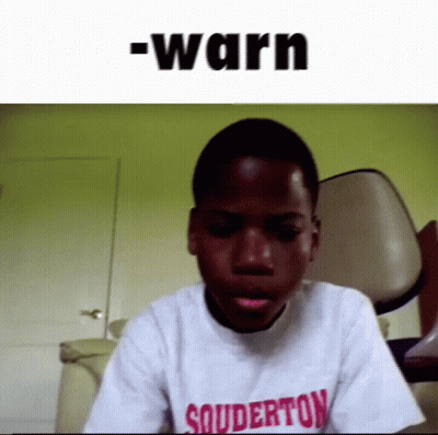 Young Boy In Souderton T-Shirt Sitting In Front Of Chair GIF
