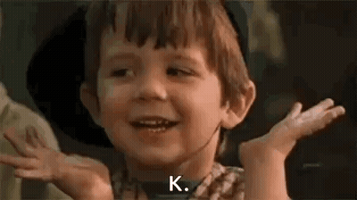 Young Boy In Striped Shirt Holding Scissors GIF