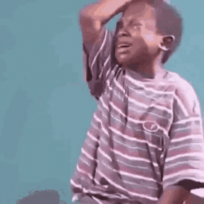 Young Boy In Striped Shirt Scratching Head GIF