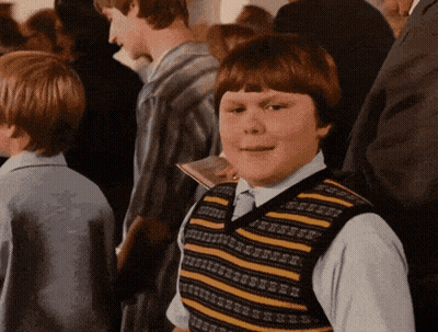 Young Boy In Striped Vest In Crowd GIF
