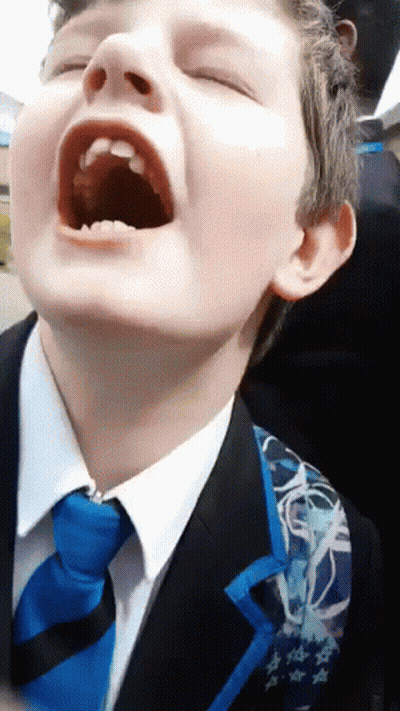 Young Boy In Suit And Tie With Mouth Open GIF