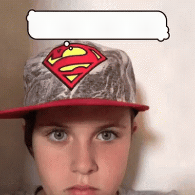 Young Boy In Superman Hat With Speech Bubble GIF