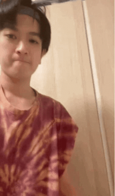 Young Boy In Tie Dye Shirt And Headband GIF