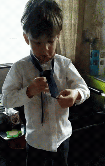Young Boy In White Shirt And Blue Tie GIF