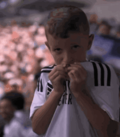 Young Boy In White Shirt With Letter R GIF