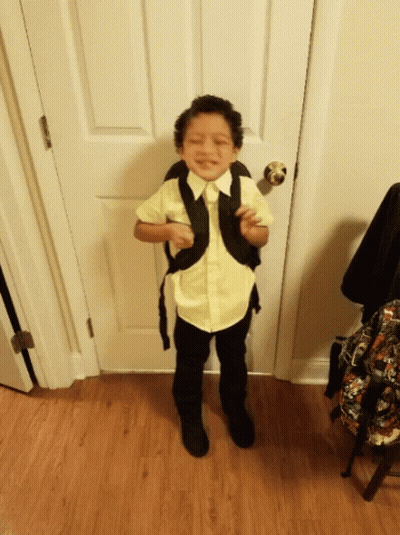 Young Boy In Yellow Shirt And Black Pants GIF