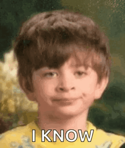 Young Boy In Yellow Shirt Making Funny Face GIF