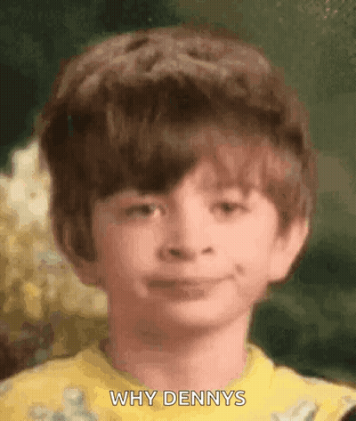 Young Boy In Yellow Shirt Making Funny Face GIF