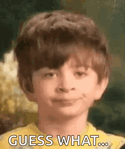 Young Boy In Yellow Shirt Smiling Guess What GIF