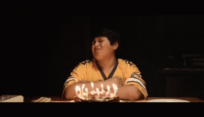 Young Boy In Yellow Shirt With Birthday Cake GIF