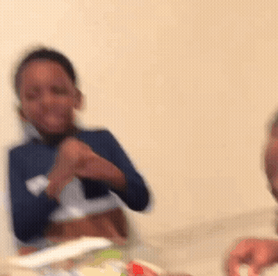 Young Boy Laughing At Table GIF