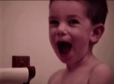 Young Boy Laughing In Bath GIF