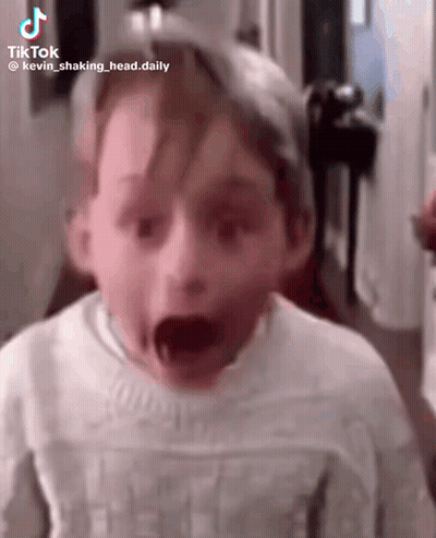 Young Boy Making Funny Face GIF