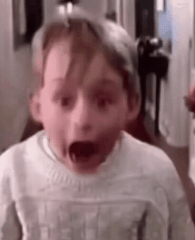 Young Boy Making Funny Face GIF