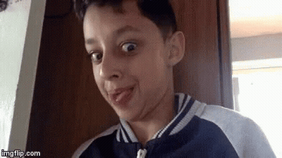 Young Boy Making Funny Face With Tongue Out GIF