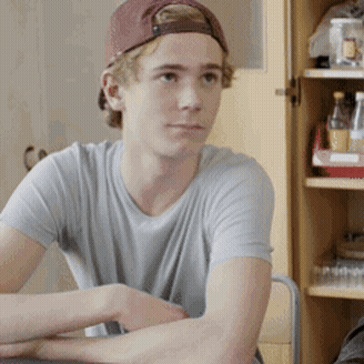 Young Boy Playing Drums In Living Room With Microphone GIF