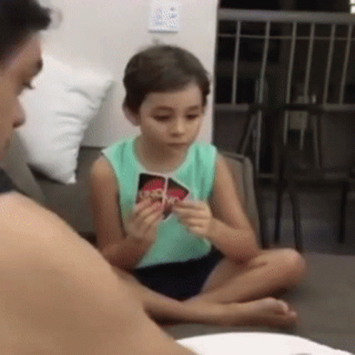 Young Boy Playing Uno With Mother GIF
