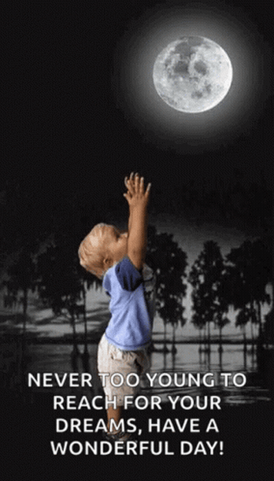 Young Boy Reaching For Moon In Black And White Photo GIF