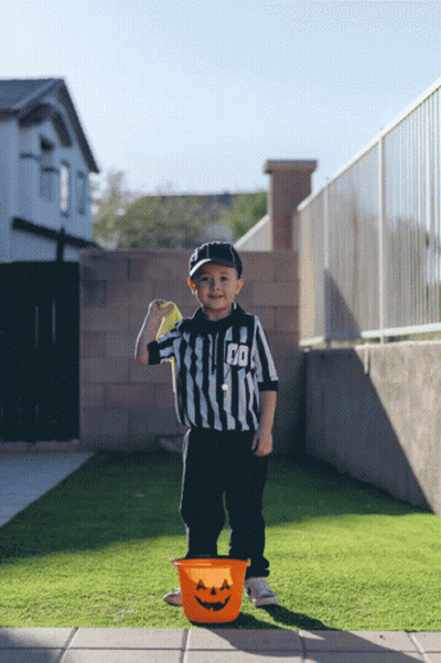 Young Boy Referee Holding Yellow Ball GIF