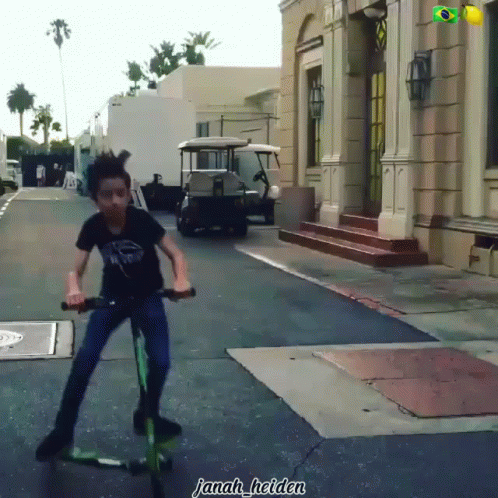 Young Boy Riding Scooter Janah Helden GIF