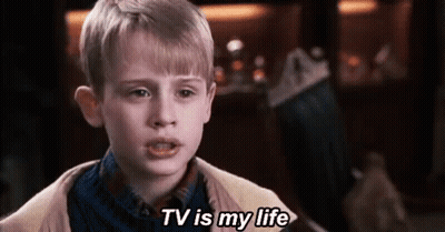 Young Boy Saying TV Is My Life In Front Of Christmas Stocking GIF