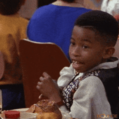 Young Boy Sitting At Table With Food And Sauce GIF