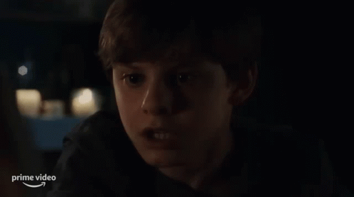Young Boy Sitting In Car At Night GIF