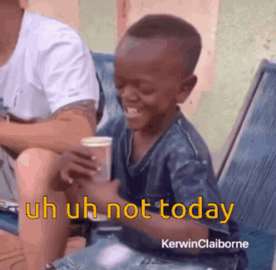 Young Boy Sitting In Chair Saying Uh Uh Not Today GIF