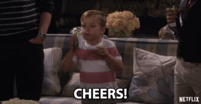 Young Boy Sitting On Couch With Netflix Logo GIF