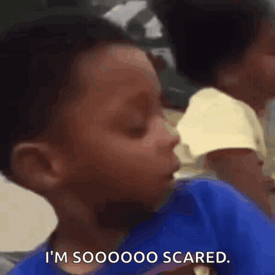 Young Boy Sitting With Eyes Closed Saying So Scared GIF