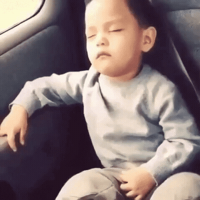 Young Boy Sleeping In Back Seat Of Car GIF