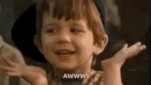 Young Boy Smiling In Cowboy Hat Making Funny Face GIF