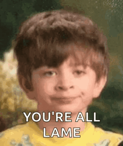 Young Boy Smiling Saying You're All Lame In Yellow Shirt GIF