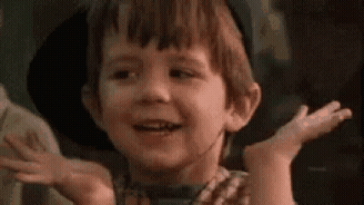 Young Boy Smiling With Hands Outstretched