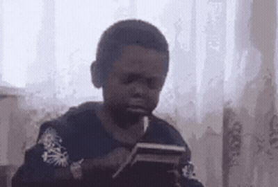 Young Boy Smoking Cigarette With Tablet GIF