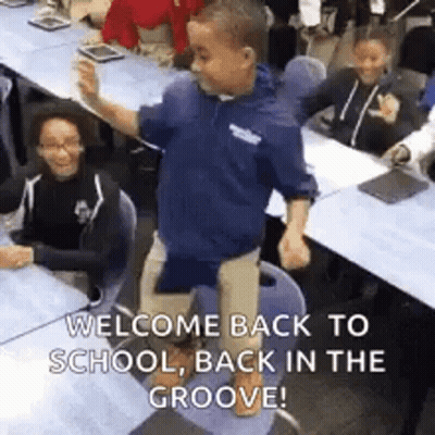 Young Boy Standing On Chair In Classroom GIF