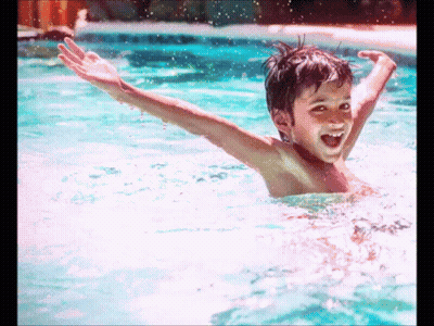 Young Boy Swimming Smiling GIF