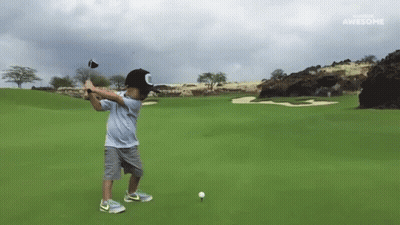 Young Boy Swings Golf Club Sponsored By Awesome GIF