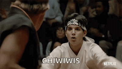 Young Boy Talking To Man In Karate Uniform GIF