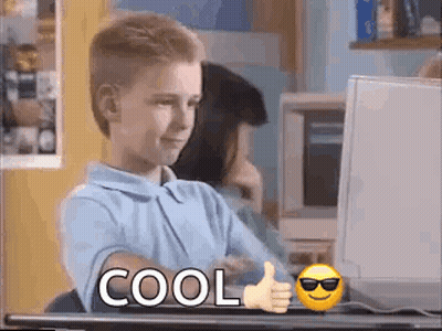 Young Boy Thumbs Up At Computer GIF