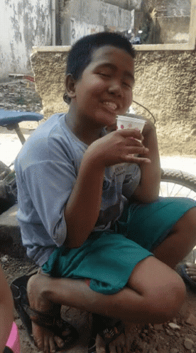 Young Boy Wearing Shirt Saying A Drinking From Cup GIF