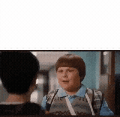 Young Boy With Backpack Talking To Another Boy In Hallway GIF