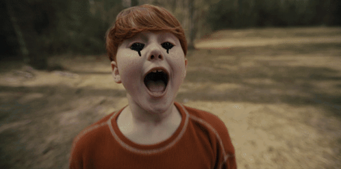 Young Boy With Black Eyes And Tears Screaming GIF