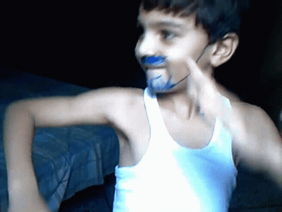 Young Boy With Blue Paint On Face And White Tank Top GIF