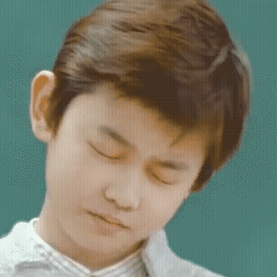 Young Boy With Eyes Closed Looking Down GIF